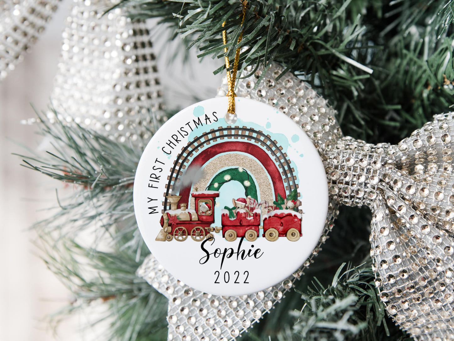 white ceramic first christmas bauble with a cute Christmas themed train and mouse design printed on with the text my first Christmas and name and year 2022 printed on
