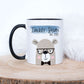 white mug with a cute bear design printed on with the text daddy bear above, The mug is sitting on a wood slice with fluffy background behind