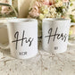 set of two white mugs. One has the text His in a script font with a name below and the other has Hers with a name below.