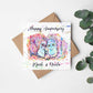 square card with a pair of apes in a colourful watercolour design printed on the front with the text happy anniversary