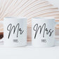 set of two white mugs. One has Mr printed on in a script font with a surname below. The other has Mrs printed on