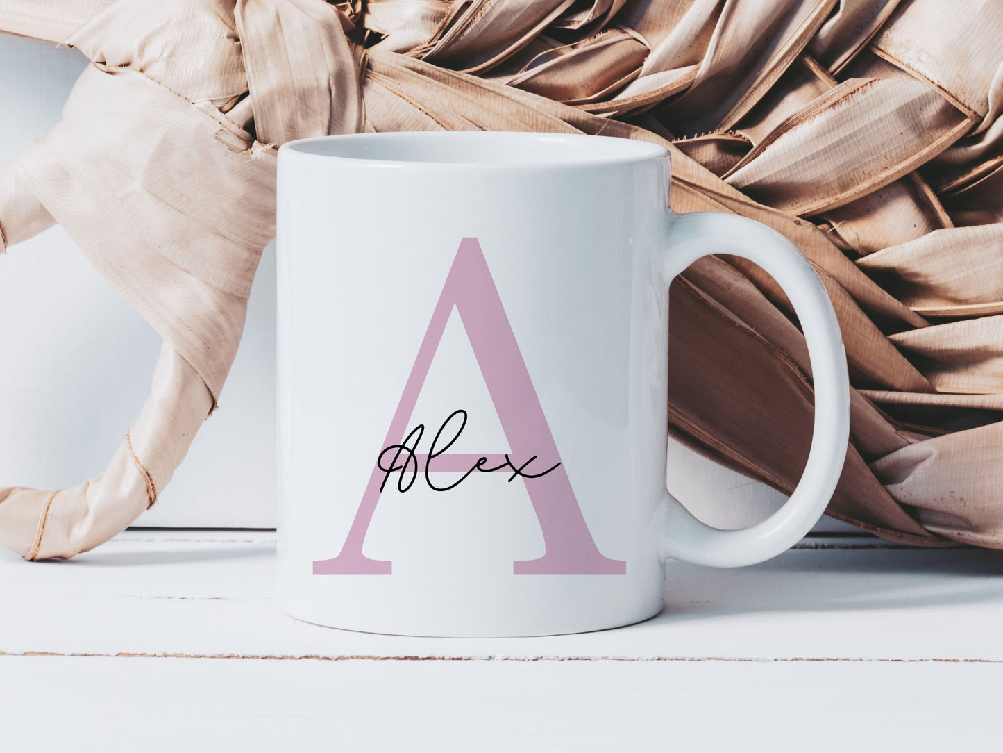 white mug with a large pink letter A and the name alex printed over in a script font